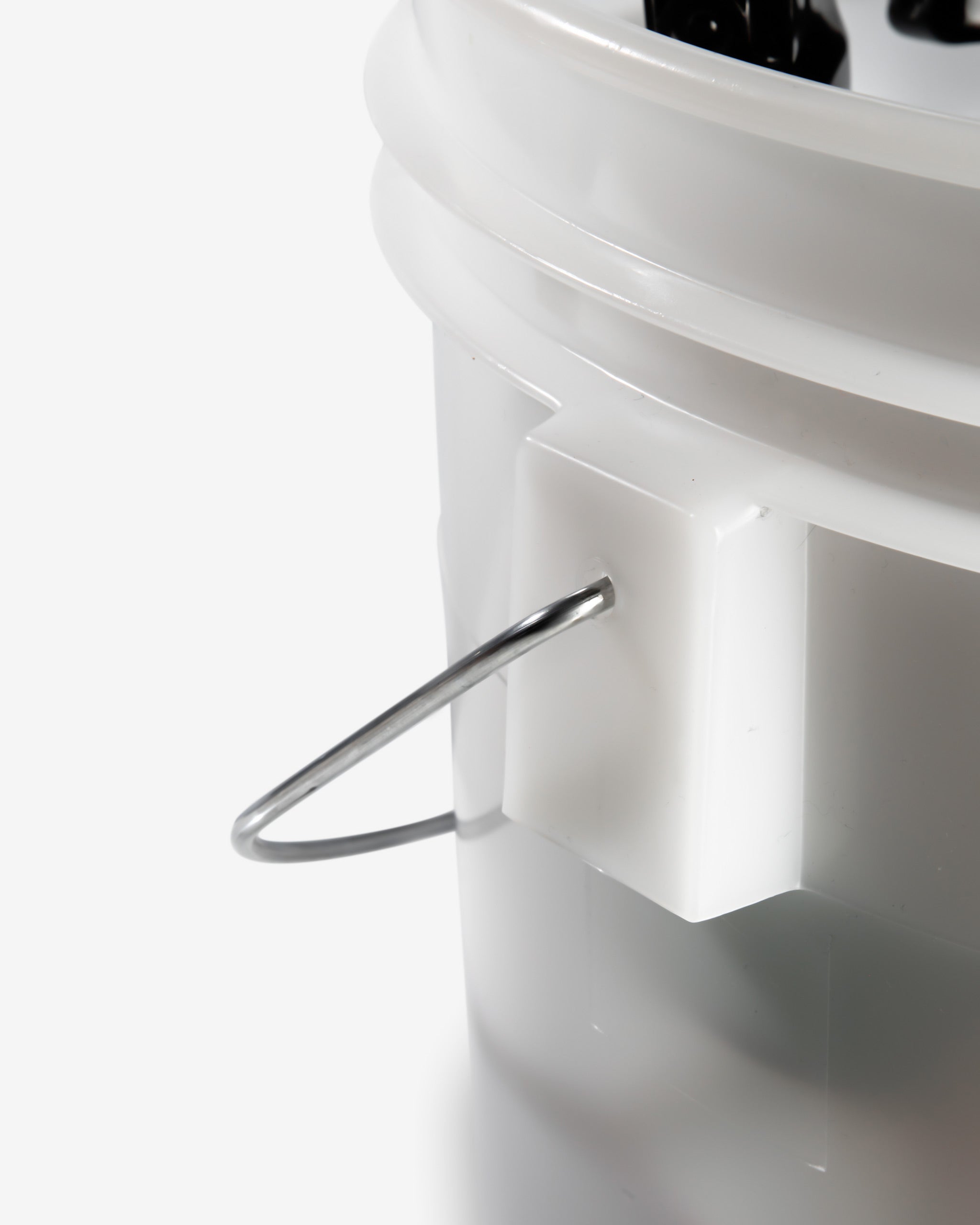 Close-up view of Adam's Mystery Bucket, featuring a section of the white plastic bucket with a metal handle, priced at $69.99.