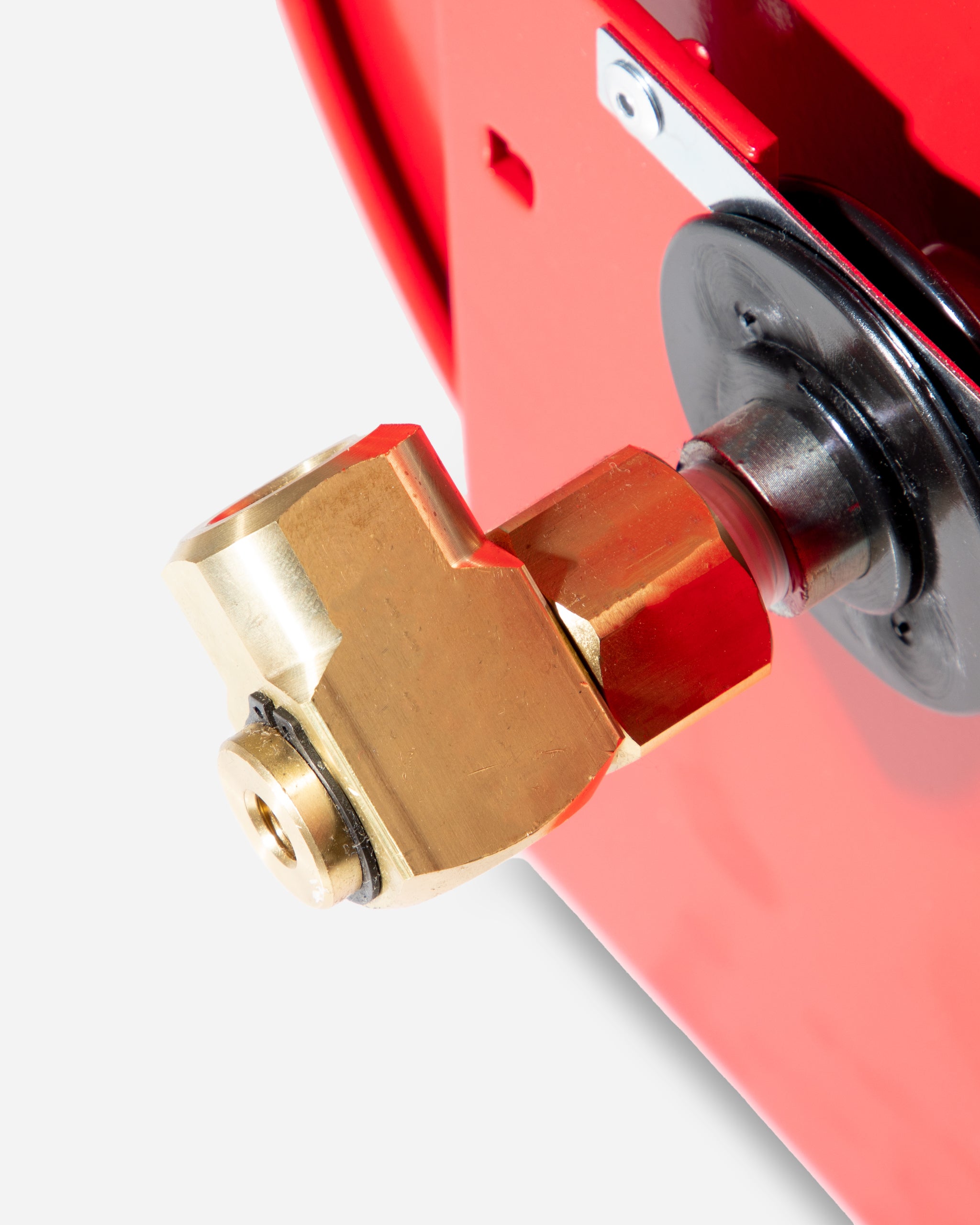 Close-up of a brass fitting on Adam's 100' Premium Hose Reel with a bright red casing and silver mounting bracket.