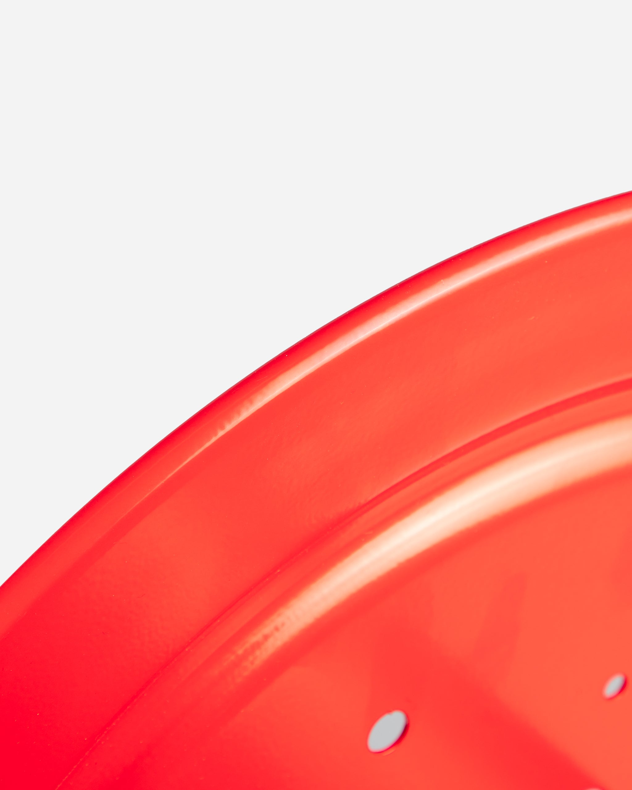 Close-up view of the vibrant red finish on Adam's 100' Premium Hose Reel, emphasizing the sleek surface and quality construction detail.