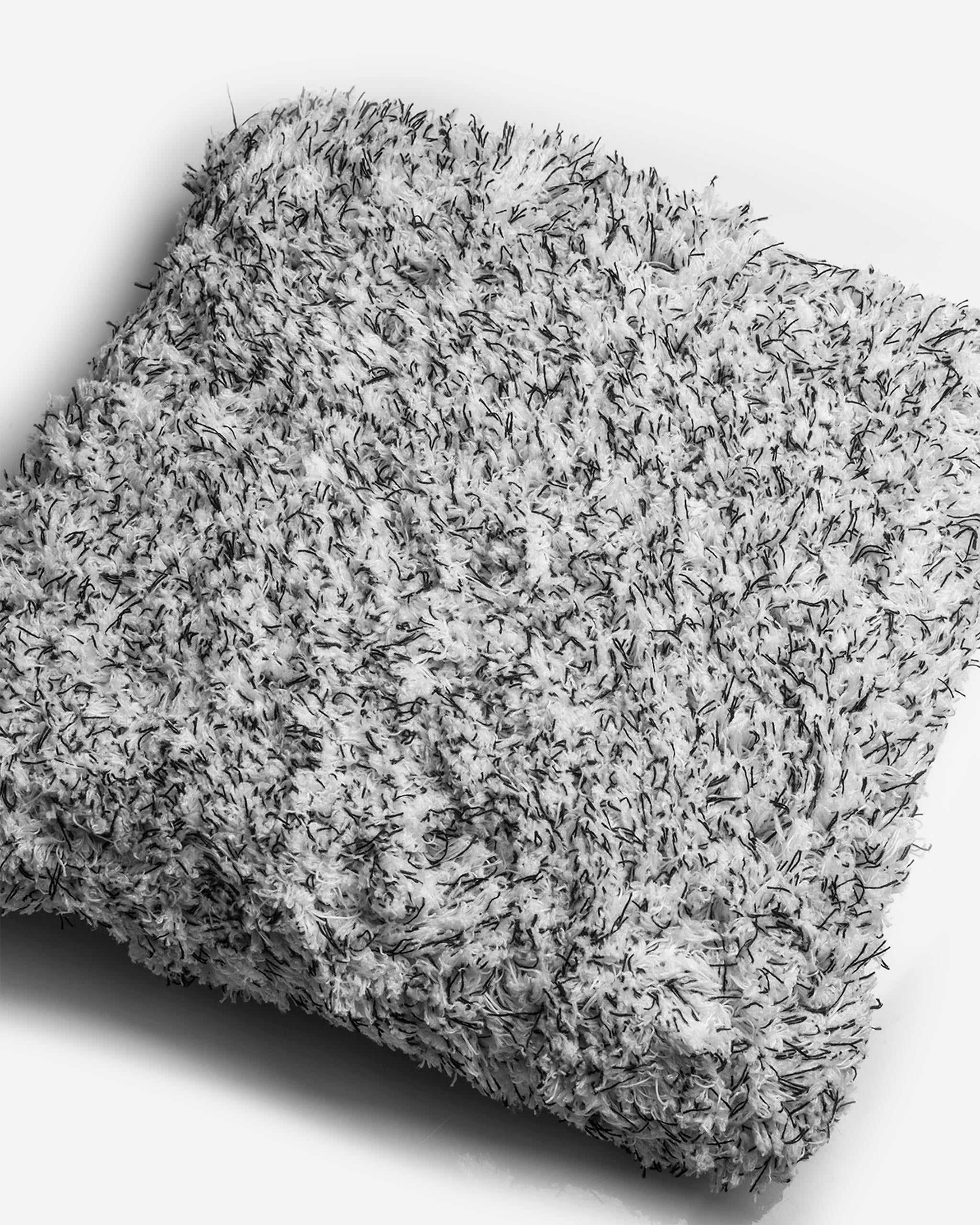 Close-up of Adam's 10-inch Microfiber Wash Sponge showing dense, soft microfiber strands for gentle and effective car cleaning.
