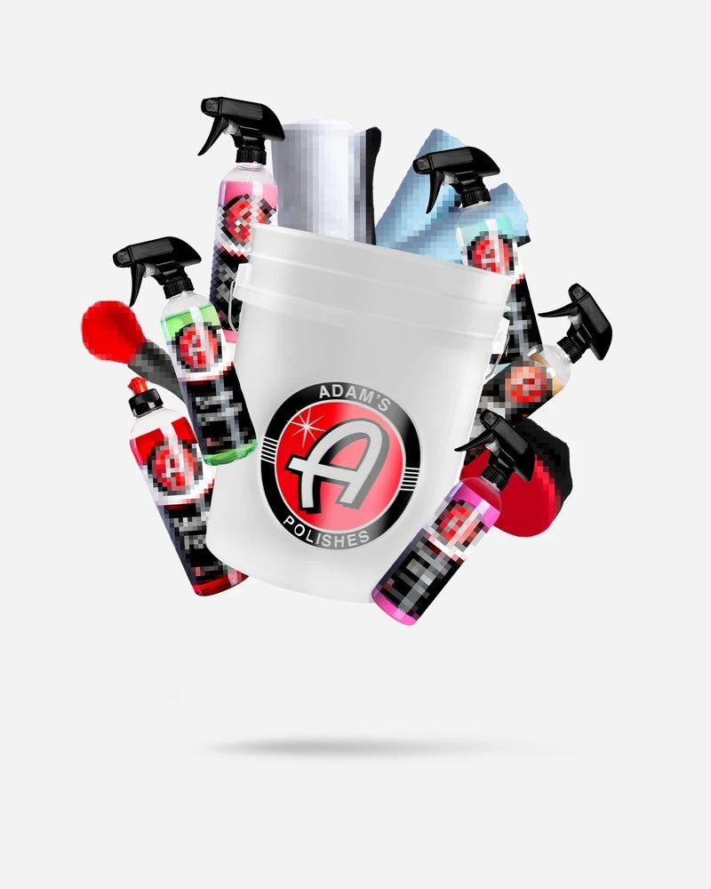 Alt text: "Adam's Polishes $149.99 Mystery Bucket featuring a white bucket filled with assorted car care products including spray bottles, microfiber towels, and applicators, all branded with the Adam's logo."