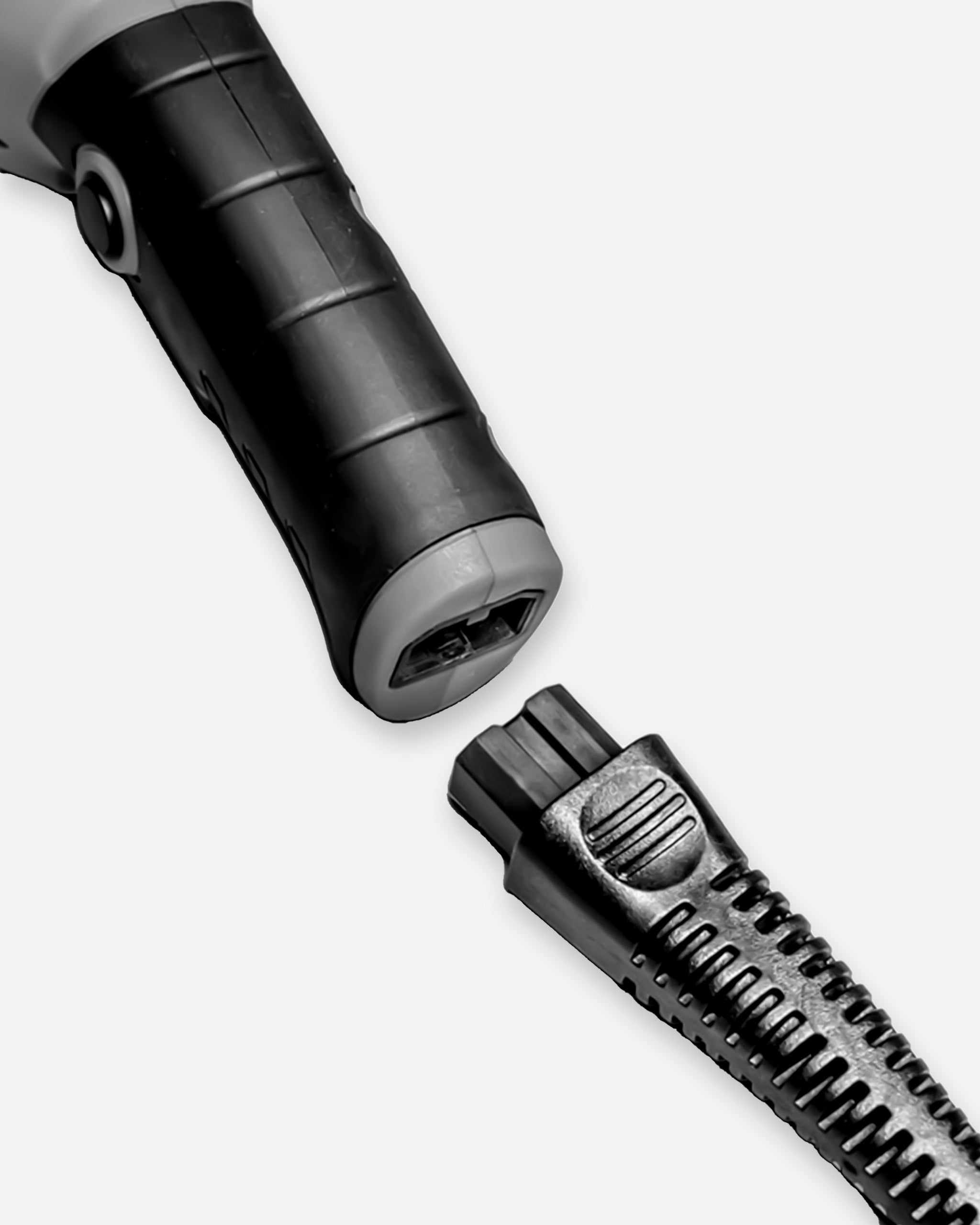 Close-up view of Adam's SK Pro 15mm Polisher, highlighting its handle and part of the head, in a grayscale color scheme.