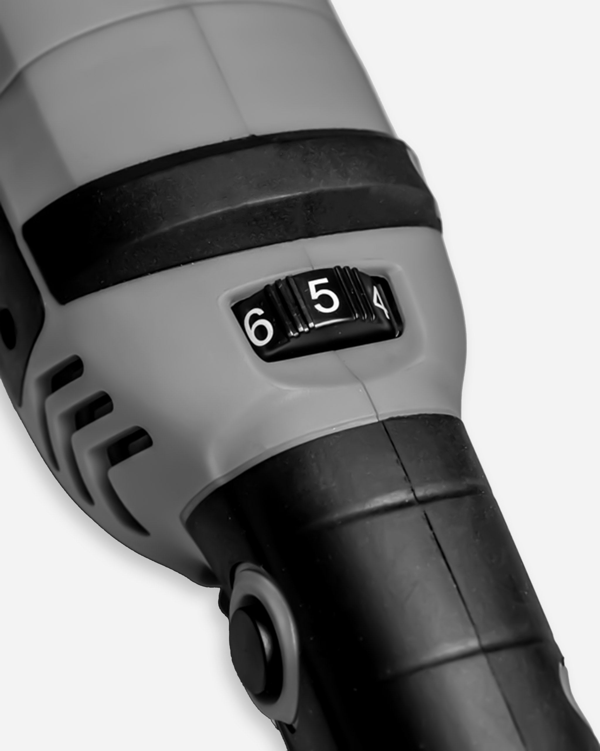 Close-up of Adam's SK Pro 15mm Polisher, focusing on the adjustable speed dial set to 6.5, highlighting the machine's precision controls and black and grey color scheme.